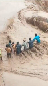 Read more about the article Dramatic Rescue Of Woman Trapped In Car Being Washed Away By Flash Floods