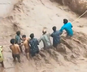 Dramatic Rescue Of Woman Trapped In Car Being Washed Away By Flash Floods