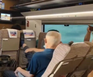 Grey-Haired Pensioner Kicks Seat Of Man In Front To Stop Him Reclining