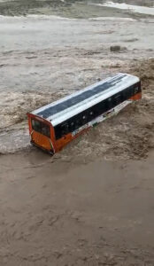 Read more about the article Bus Gets Stuck On Flooded Causeway With Diggers Used For Dramatic Rescue