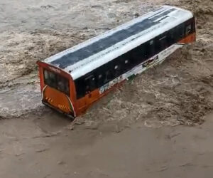 Bus Gets Stuck On Flooded Causeway With Diggers Used For Dramatic Rescue