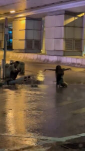 Read more about the article Woman Poses For Photos In The Rain Amid One Of The Most Violent Storms In Decades