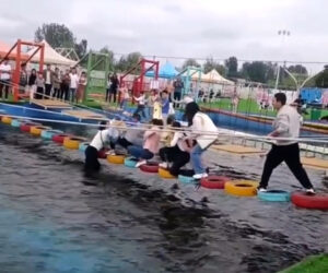 Crazed Woman Tries To Knock Terrified Children Off Suspended Bridge