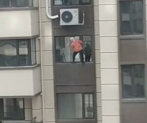 Housewife Risks Falling As She Stands On 100-Ft-Tall Ledge Cleaning Windows