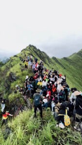 Read more about the article Thousands Of Tourist Hikers Swarm Mountaintop