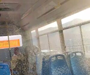 Bus Passengers Covered In Snow Falling Through Broken Roof