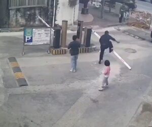 Man Angrily Destroys Parking Gate After It Struck His Female Companion